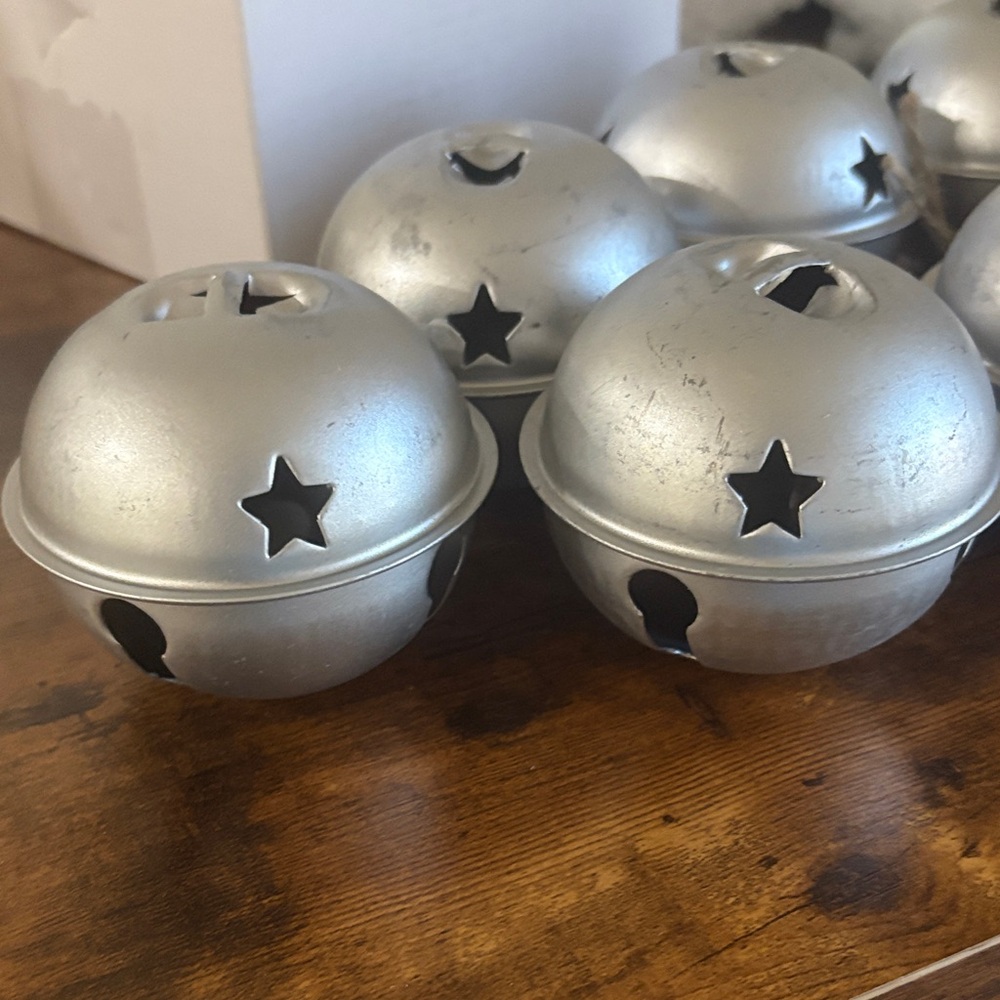 7 Silver Jingle Bells with Star Cutouts